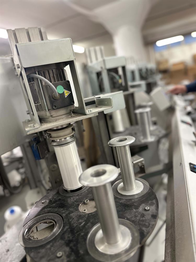 Row of covering machines on the production floor