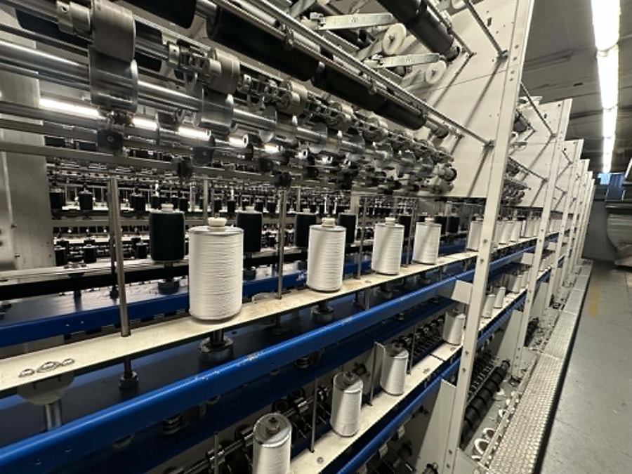 Spools of covered yarn